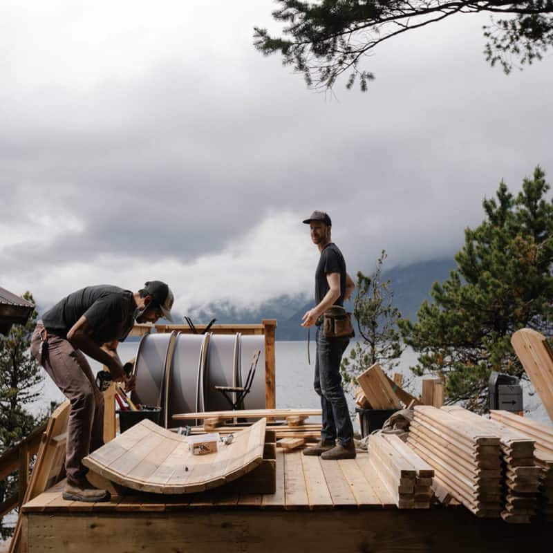 Men building outdoor sauna